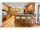 Kitchen includes wood cabinets, granite counters, and stainless steel appliances at 3935 Pierson St, Wheat Ridge, CO 80033