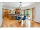 Open kitchen featuring wood cabinets, stainless steel appliances, and breakfast bar seating at 3935 Pierson St, Wheat Ridge, CO 80033