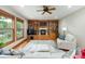 Bright living room features hardwood floors, wood-burning fireplace, and custom built-ins at 3935 Pierson St, Wheat Ridge, CO 80033