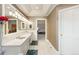 Bright main bathroom boasts double sinks, marble countertops, and stylish fixtures at 3935 Pierson St, Wheat Ridge, CO 80033