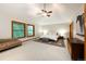 Serene main bedroom retreat with vaulted ceiling, sitting area, and neutral decor at 3935 Pierson St, Wheat Ridge, CO 80033