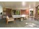 Covered patio with stylish outdoor furniture, creating a relaxing and inviting space at 3935 Pierson St, Wheat Ridge, CO 80033
