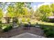 Cozy backyard patio with comfortable seating around a fire pit at 3935 Pierson St, Wheat Ridge, CO 80033