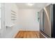 Bright kitchen featuring stainless steel appliances, wood floors and modern shelving at 1279 Leyden St, Denver, CO 80220