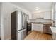 Modern kitchen with stainless steel appliances and bright white cabinetry at 1279 Leyden St, Denver, CO 80220