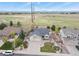 Scenic aerial shot of a home with large driveway and a brick-laid walkway on the side yard at 1457 Rosedale St, Castle Rock, CO 80104