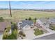 Desirable neighborhood home with a manicured lawn, set against the backdrop of an open field at 1457 Rosedale St, Castle Rock, CO 80104