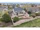 Large backyard with a covered patio, a fire pit, and a tranquil water feature at 1457 Rosedale St, Castle Rock, CO 80104