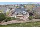 Large backyard with an inviting covered patio, a fire pit, and a peaceful water feature at 1457 Rosedale St, Castle Rock, CO 80104