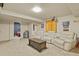 Finished basement with comfortable seating and space for entertainment at 1457 Rosedale St, Castle Rock, CO 80104