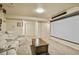 Spacious basement area perfect for entertaining with movie screen, comfortable seating, and neutral carpeting at 1457 Rosedale St, Castle Rock, CO 80104