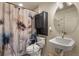 Cozy bathroom featuring floral shower curtain and circular mirror at 1457 Rosedale St, Castle Rock, CO 80104