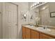 Bright bathroom with double sinks, vanity, and well-lit mirror at 1457 Rosedale St, Castle Rock, CO 80104