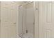 Modern bathroom shower with glass door and white tile at 1457 Rosedale St, Castle Rock, CO 80104