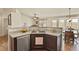 Functional kitchen with stainless steel dishwasher and open layout to dining area and living area at 1457 Rosedale St, Castle Rock, CO 80104