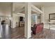 Open-concept living area with wood floors, providing ample space for relaxing and entertaining at 1457 Rosedale St, Castle Rock, CO 80104