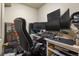 Home office featuring a modern desk, ergonomic chair, and multiple computer monitors for maximum productivity at 1457 Rosedale St, Castle Rock, CO 80104