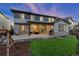 This is a view of an outdoor patio featuring string lights and a seating area for relaxation at 515 Orion Ave, Erie, CO 80516