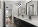 Elegant bathroom featuring double sinks, modern fixtures, and stylish design at 515 Orion Ave, Erie, CO 80516