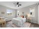 Spacious bedroom with ample natural light, a ceiling fan, and tasteful decor at 515 Orion Ave, Erie, CO 80516
