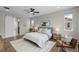 Comfortable bedroom with a ceiling fan, wood floors, and a neutral color palette at 515 Orion Ave, Erie, CO 80516