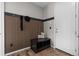 Welcoming entryway features wood slat wall, storage bench, and coat hooks at 515 Orion Ave, Erie, CO 80516