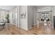 Bright entryway featuring wood floors and view of the dining area at 515 Orion Ave, Erie, CO 80516