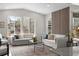 Bright living room with recessed lighting, modern furniture and large windows at 515 Orion Ave, Erie, CO 80516