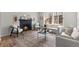 Inviting living room with brick fireplace and modern decor creates a cozy and stylish space for relaxation at 515 Orion Ave, Erie, CO 80516