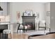 Bright living room features a modern fireplace and comfortable seating, creating a cozy and inviting atmosphere at 515 Orion Ave, Erie, CO 80516