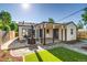 Outdoor patio with seating area, wood burning stove, and access to landscaped yard at 1060 Grove St, Denver, CO 80204
