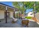 Outdoor patio with seating area, wood burning stove, and access to landscaped yard at 1060 Grove St, Denver, CO 80204