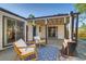 Outdoor patio with seating area, wood burning stove, and access to landscaped yard at 1060 Grove St, Denver, CO 80204