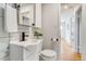 Bright bathroom features modern fixtures, white vanity, and stylish subway tile at 1060 Grove St, Denver, CO 80204