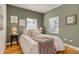 Inviting bedroom with neutral bedding, art prints, and natural light at 1060 Grove St, Denver, CO 80204