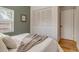 Bedroom featuring a large closet, a window, and modern accents at 1060 Grove St, Denver, CO 80204