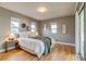 Comfortable main bedroom with hardwood floors, natural light and neutral paint color at 1060 Grove St, Denver, CO 80204