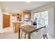 Bright dining area with modern table set and view to the backyard patio at 1060 Grove St, Denver, CO 80204
