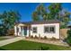 A well-maintained house with tidy landscaping features and a classic design at 1060 Grove St, Denver, CO 80204