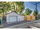 View of the detached garage and privacy fence at 1060 Grove St, Denver, CO 80204