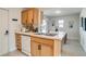 Bright kitchen features stone counters, stainless steel sink, wood cabinets and updated appliances at 1060 Grove St, Denver, CO 80204