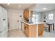 Bright kitchen features stone counters, stainless steel sink, wood cabinets and an eat-in dining area at 1060 Grove St, Denver, CO 80204