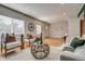 Sunlit living room with hardwood floors and contemporary furnishings with window blinds at 1060 Grove St, Denver, CO 80204