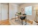 Office space featuring modern desk, chair, and ample natural light at 1060 Grove St, Denver, CO 80204