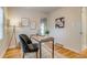 Modern office with a sleek desk, chair, and hardwood floors at 1060 Grove St, Denver, CO 80204