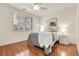Light and bright bedroom with hardwood floors, ceiling fan and window with plantation shutters at 19691 E 59Th Dr, Aurora, CO 80019