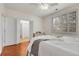 Comfortable bedroom with hardwood floors, ceiling fan, shuttered window and bi-fold doors at 19691 E 59Th Dr, Aurora, CO 80019