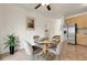 Open concept kitchen and dining room with stainless appliances and seating for four at 19691 E 59Th Dr, Aurora, CO 80019