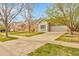 Street view of a home with a well-maintained lawn and concrete driveway leading to an attached two-car garage at 19691 E 59Th Dr, Aurora, CO 80019