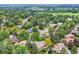 A picturesque aerial view of a neighborhood with tree-lined streets and lush greenery, highlighting its serene setting at 2473 S Carr Ct, Lakewood, CO 80227
